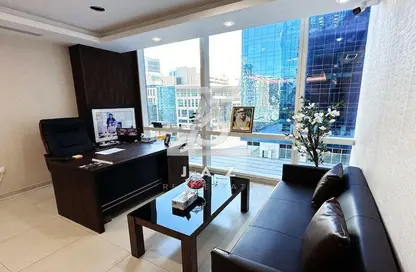 Living Room image for: Office Space - Studio - 1 Bathroom for rent in Tamani Art Tower - Business Bay - Dubai, Image 1