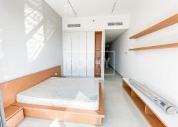 Room / Bedroom image for: Studio - 1 bathroom for sale in Blue Waves Tower - Dubai Residence Complex - Dubai, Image 1