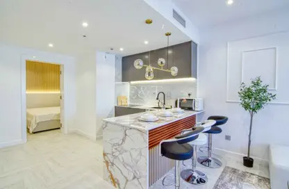 صورة لـ مطبخ شقة - 2 غرف نوم - 2 حمامات للايجار في بوابة دبي الجديدة 1 - بحيرة إلوشيو - أبراج بحيرة الجميرا - دبي ، صورة رقم 1