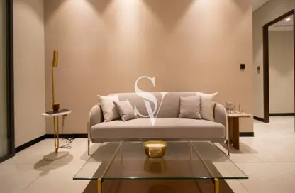 Living Room image for: Apartment - 2 Bedrooms - 3 Bathrooms for sale in Marquis Galleria - Arjan - Dubai, Image 1
