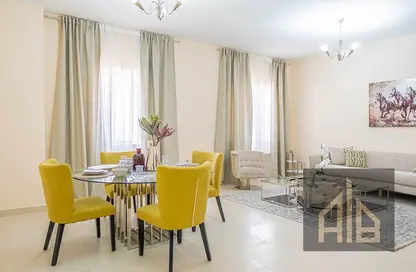 Living / Dining Room image for: Apartment - 2 Bedrooms - 3 Bathrooms for sale in Al Ameera Village - Ajman, Image 1