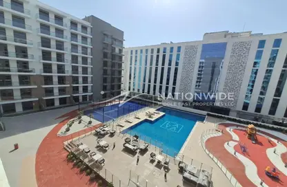 Pool image for: Apartment - 1 Bedroom - 2 Bathrooms for rent in Laya Heights - Dubai Studio City - Dubai, Image 1