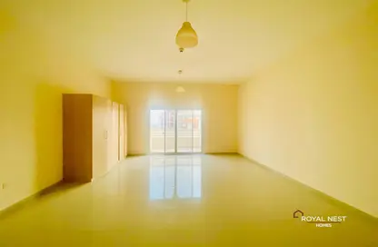 Empty Room image for: Apartment - 1 Bathroom for sale in Madison Residences - Majan - Dubai, Image 1