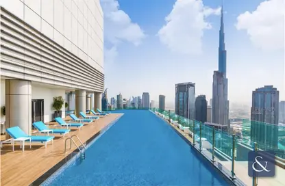 صورة لـ حوض سباحة شقة - غرفة نوم - 2 حمامات للبيع في فندق ومساكن برج باراماونت - الخليج التجاري - دبي ، صورة رقم 1