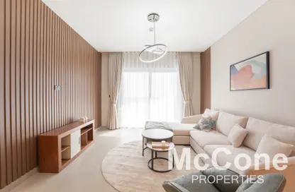 Living Room image for: Apartment - 1 Bedroom - 2 Bathrooms for rent in Waves Grande - Sobha Hartland - Mohammed Bin Rashid City - Dubai, Image 1