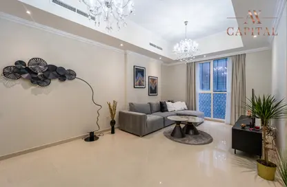 Living Room image for: Apartment - 1 Bedroom - 2 Bathrooms for sale in Dunya Tower - Burj Khalifa Area - Downtown Dubai - Dubai, Image 1