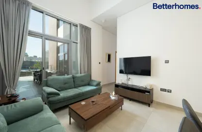 Living Room image for: Apartment - 2 Bedrooms - 3 Bathrooms for sale in Pantheon Elysee - Jumeirah Village Circle - Dubai, Image 1