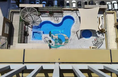 صورة لـ حوض سباحة شقة - غرفة نوم - 2 حمامات للايجار في المعمورة - منطقة المرور - أبوظبي ، صورة رقم 1