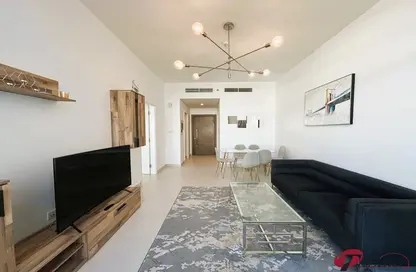 Living Room image for: Apartment - 1 Bedroom - 2 Bathrooms for rent in Prime Views by Prescott - Meydan Avenue - Meydan - Dubai, Image 1