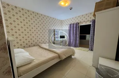 Room / Bedroom image for: Apartment - 1 Bedroom - 2 Bathrooms for sale in Orient Towers - Al Bustan - Ajman, Image 1