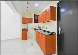 صورةمطبخ لـ: شقة - 1 غرفة نوم - 2 حمامات للبيع في بناية لولينا - قرية الجميرا سركل - دبي, صورة 1