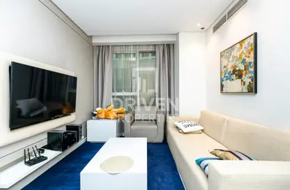 Living Room image for: Apartment - 1 Bedroom - 2 Bathrooms for sale in DAMAC Maison The Vogue - Business Bay - Dubai, Image 1