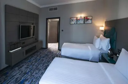 Room / Bedroom image for: Apartment - 2 Bedrooms - 2 Bathrooms for rent in Edge Creekside Hotel - Deira - Dubai, Image 1