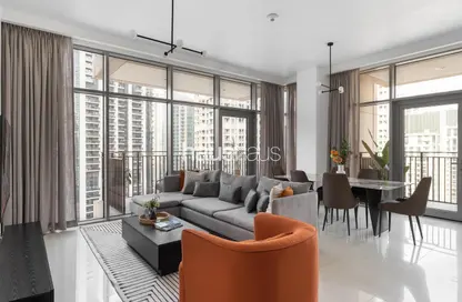 Living / Dining Room image for: Apartment - 2 Bedrooms - 3 Bathrooms for rent in Boulevard Crescent 2 - BLVD Crescent - Downtown Dubai - Dubai, Image 1