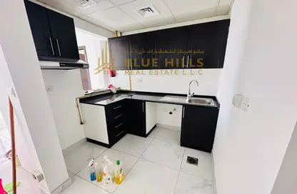 Kitchen image for: Apartment - 1 Bedroom - 2 Bathrooms for rent in The Pearl - Culture Village - Dubai, Image 1