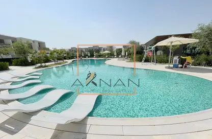 Pool image for: Villa - 3 Bedrooms - 3 Bathrooms for rent in Elan - Tilal Al Ghaf - Dubai, Image 1