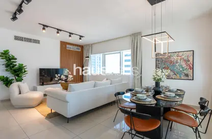 Living / Dining Room image for: Apartment - 2 Bedrooms - 2 Bathrooms for rent in Marina Pinnacle - Dubai Marina - Dubai, Image 1