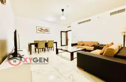 Living / Dining Room image for: Apartment - 2 Bedrooms - 3 Bathrooms for rent in Al Jazeera Tower - Corniche Road - Abu Dhabi, Image 1