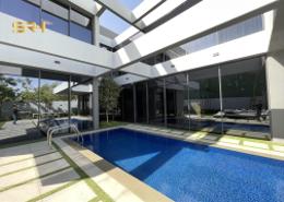 Pool image for: Villa - 4 bedrooms - 6 bathrooms for sale in Robinia - Masaar - Tilal City - Sharjah, Image 1