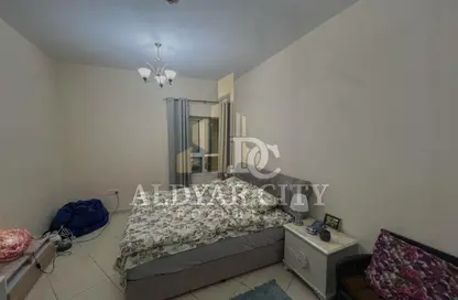 شقة - غرفة نوم - 1 حمام للايجار في أورينت تاور 1 - أورينت تاور - البستان - عجمان