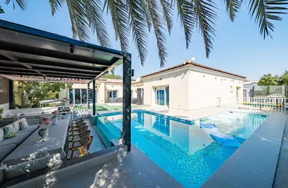 Villa - 4 Bedrooms - 6 Bathrooms for sale in Bungalow Area - Green Community Motor City - Motor City - Dubai