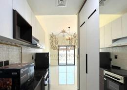 Kitchen image for: Studio - 1 bathroom for rent in Wavez Residence - Liwan - Dubai Land - Dubai, Image 1