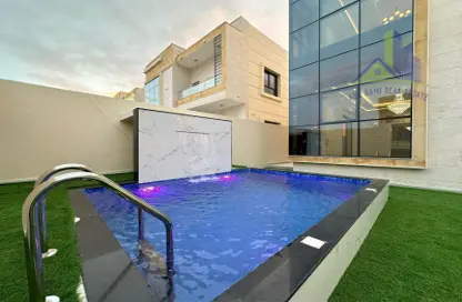 Pool image for: Villa - 5 Bedrooms - 6 Bathrooms for sale in Al Zaheya Gardens - Al Zahya - Ajman, Image 1