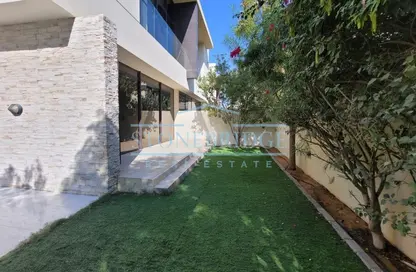 Garden image for: Villa - 3 Bedrooms - 5 Bathrooms for rent in Flora - DAMAC Hills - Dubai, Image 1