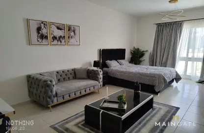 Living Room image for: Apartment - 1 Bathroom for sale in Maple 1 - Emirates Gardens 2 - Jumeirah Village Circle - Dubai, Image 1