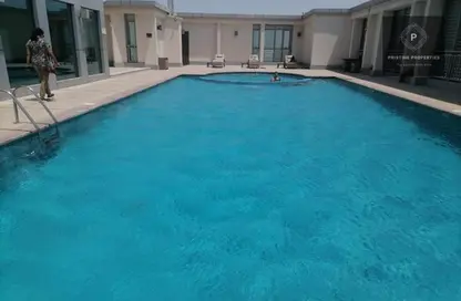 صورة لـ حوض سباحة شقة - 2 غرف نوم - 3 حمامات للايجار في برج المرجان - دانة بو ظبي - أبوظبي ، صورة رقم 1