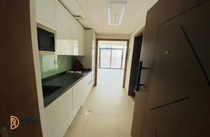 صورة لـ مطبخ شقة - 1 حمام للبيع في أسطورة الشروق - ارجان - دبي ، صورة رقم 1