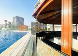 Pool image for: Studio - 1 bathroom for rent in Wavez Residence - Liwan - Dubai Land - Dubai, Image 1