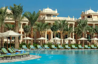 Pool image for: Apartment - 3 Bedrooms - 4 Bathrooms for sale in Raffles The Palm - The Crescent - Palm Jumeirah - Dubai, Image 1
