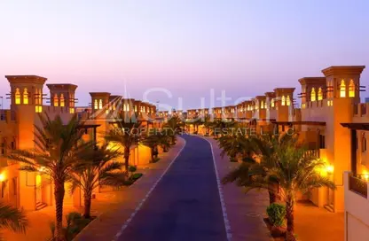 Outdoor Building image for: Townhouse - 3 Bedrooms - 4 Bathrooms for sale in The Townhouses at Al Hamra Village - Al Hamra Village - Ras Al Khaimah, Image 1