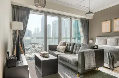Living Room image for: Apartment - 1 Bathroom for rent in 8 Boulevard Walk - Mohammad Bin Rashid Boulevard - Downtown Dubai - Dubai, Image 1