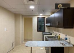 صورةمطبخ لـ: شقة - 1 غرفة نوم - 2 حمامات للبيع في بوابة السيليكون رقم 1 - بوابات السيليكون - واحة السيليكون - دبي, صورة 1