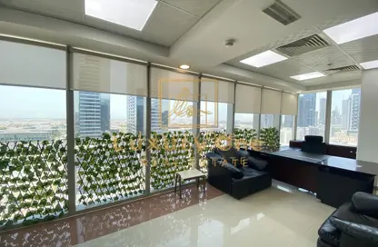 Office Space - Studio - 2 Bathrooms for rent in The Prism - Business Bay - Dubai
