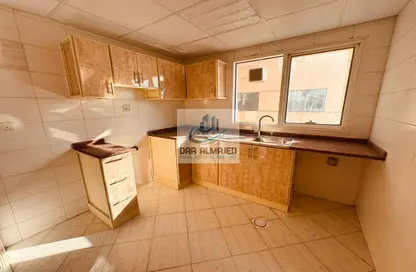 Kitchen image for: Apartment - 2 Bedrooms - 2 Bathrooms for rent in Bukhara Street - Al Nahda - Sharjah, Image 1