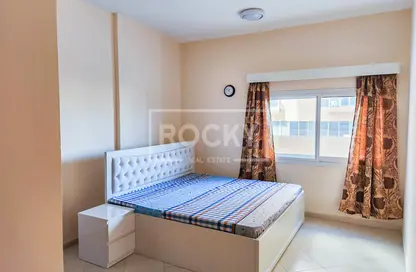 Room / Bedroom image for: Apartment - 1 Bedroom - 2 Bathrooms for rent in Lynx Residence - Dubai Silicon Oasis - Dubai, Image 1
