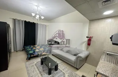 صورة لـ غرفة المعيشة شقة - 1 حمام للايجار في الجرف 2 - الجرف - عجمان وسط المدينة - عجمان ، صورة رقم 1