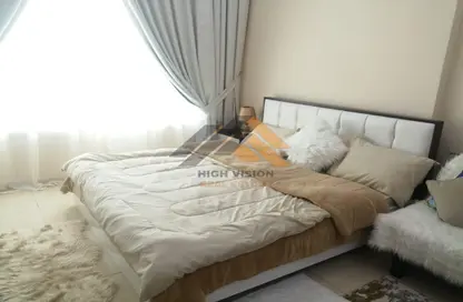 Room / Bedroom image for: Apartment - 1 Bathroom for rent in Orient Towers - Al Bustan - Ajman, Image 1