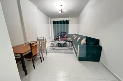 Living / Dining Room image for: Apartment - 1 Bedroom - 2 Bathrooms for rent in Sheikh Jaber Al Sabah Street - Al Naimiya - Al Nuaimiya - Ajman, Image 1