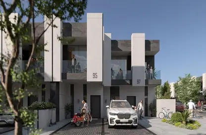 Outdoor Building image for: Townhouse - 4 Bedrooms - 5 Bathrooms for sale in Reportage Village 1 - Dubai Land - Dubai, Image 1