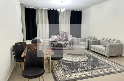 Living / Dining Room image for: Apartment - 2 Bedrooms - 3 Bathrooms for rent in Ajman Corniche Residences - Ajman Corniche Road - Ajman, Image 1