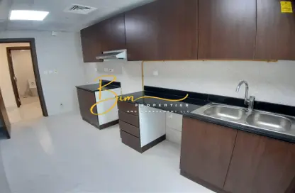 Kitchen image for: Apartment - 2 Bedrooms - 2 Bathrooms for rent in Global Tower - Electra Street - Abu Dhabi, Image 1