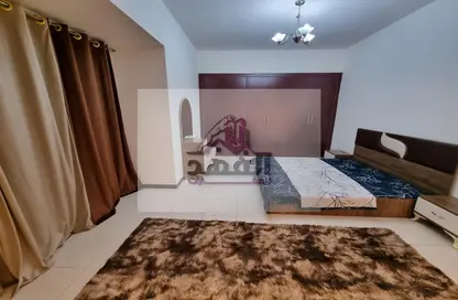 Room / Bedroom image for: Apartment - 1 Bedroom - 1 Bathroom for rent in Sonya Tower - Sheikh Khalifa Bin Zayed Street - Ajman, Image 1
