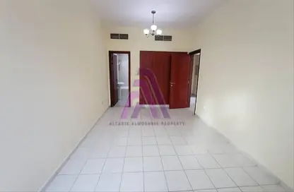 Empty Room image for: Apartment - 1 Bedroom - 2 Bathrooms for rent in Y12 - England Cluster - International City - Dubai, Image 1