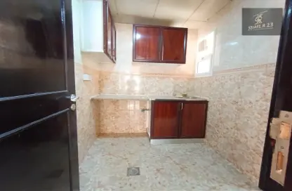 Kitchen image for: Apartment - 1 Bedroom - 2 Bathrooms for rent in Mohammed Villas 24 - Mohamed Bin Zayed City - Abu Dhabi, Image 1