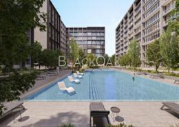 Pool image for: Apartment - 1 bedroom - 2 bathrooms for sale in Nasaq - Aljada - Sharjah, Image 1