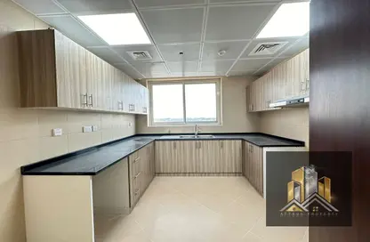 Kitchen image for: Apartment - 2 Bedrooms - 2 Bathrooms for rent in Villa Compound - Khalifa City - Abu Dhabi, Image 1